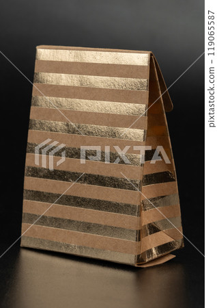 Gift brown paper box with gold foil stripes Gift brown paper box with gold foil stripes 119065587
