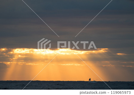The sea in Chiba with the sun shining through the clouds The sea in Chiba with the sun shining through the clouds 119065973