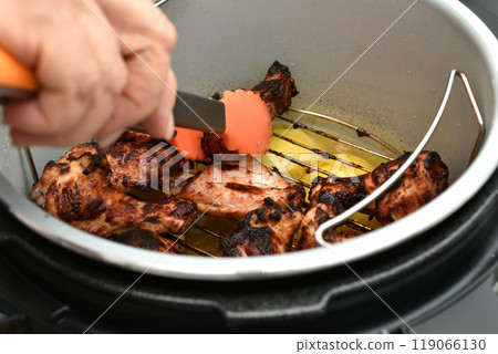 Cooking meat in a multicooker. Cooking meat in a multicooker. 119066130