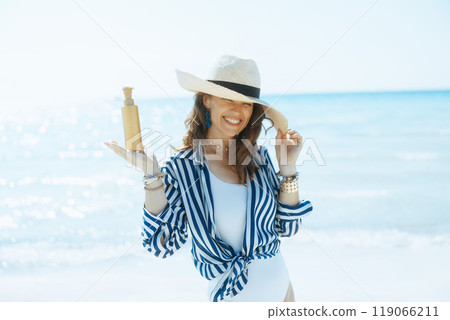 smiling elegant woman on seashore smiling elegant woman on seashore 119066211