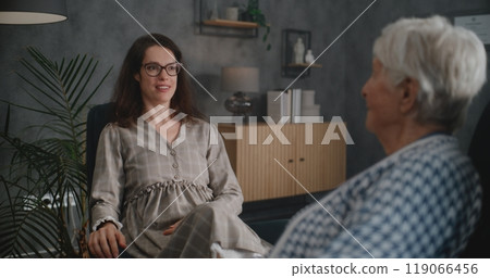 Female psychotherapist encourages elderly patient during consultation Female psychotherapist encourages elderly patient during consultation 119066456