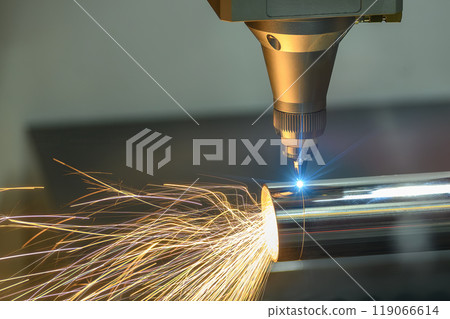 Close up scene the fiber laser cutting machine cut the stainless steel tube and sparkling light. Close up scene the fiber laser cutting machine cut the stainless steel tube and sparkling light. 119066614