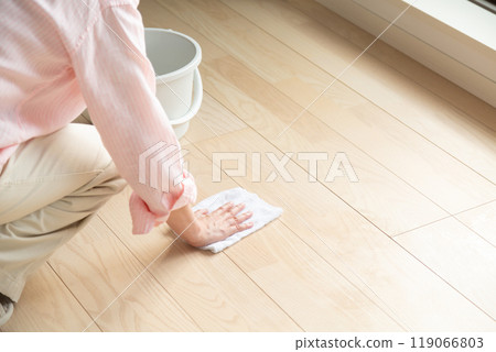 Middle-aged to senior women wiping the floor 119066803