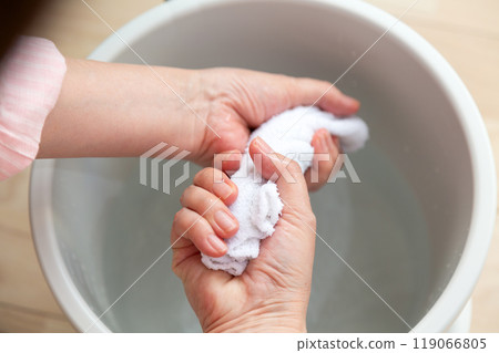 Middle-aged to senior women wiping the floor 119066805