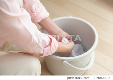 Middle-aged to senior women wiping the floor 119066806