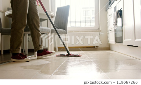 Woman Mopping Kitchen Tiled Floor 119067266