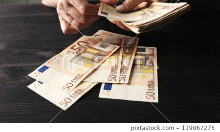 Female Hands Count Euro Money Fifty Bills On A Table Female Hands Count Euro Money Fifty Bills On A Table 119067275