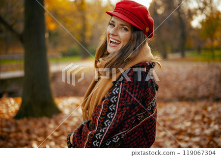 Portrait of happy elegant woman in red hat with scarf Portrait of happy elegant woman in red hat with scarf 119067304