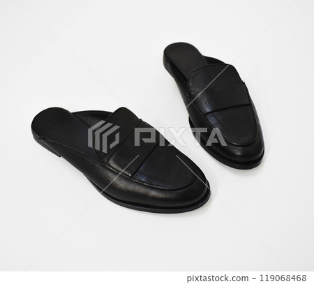 Classic black leather slide loafers isolated on white, basic spring slides, chunky mules for women 119068468