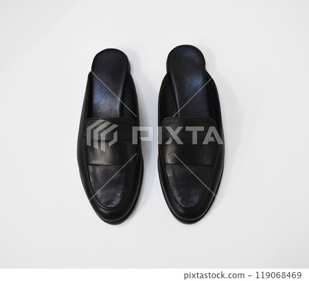 Classic black leather slide loafers isolated on white, basic spring slides, chunky mules for women 119068469