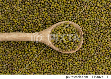 wooden spoon on mung bean background wooden spoon on mung bean background 119069191