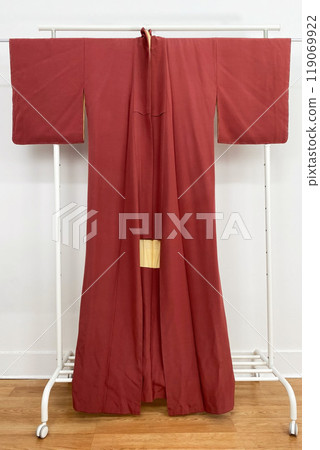 Colorful kimono robe on a hanger, promo photo for an online women's clothing store Colorful kimono robe on a hanger, promo photo for an online women's clothing store 119069922