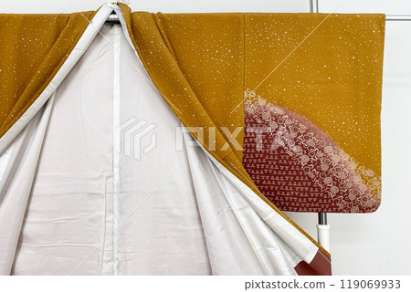 Colorful kimono robe on a hanger, promo photo for an online women's clothing store Colorful kimono robe on a hanger, promo photo for an online women's clothing store 119069933