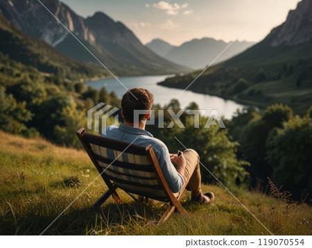 sitting man relaxes against a beautiful natural landscape sitting man relaxes against a beautiful natural landscape 119070554