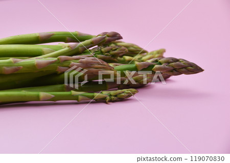 Asparagus on a pink background Asparagus on a pink background 119070830