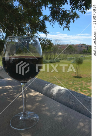 A glass of wine on a cafe table, drinks on the table in a restaurant 119070914