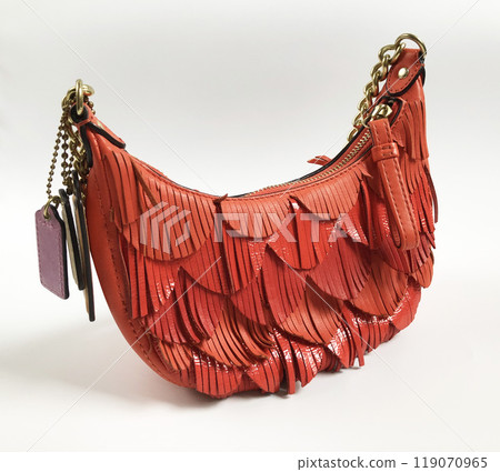 Vintage orange leather hobo bag on white background Vintage orange leather hobo bag on white background 119070965