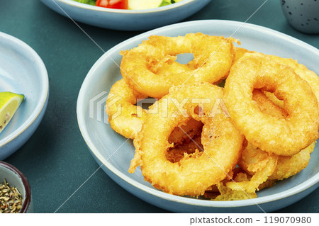 Delicious deep-fried calamari rings. Delicious deep-fried calamari rings. 119070980