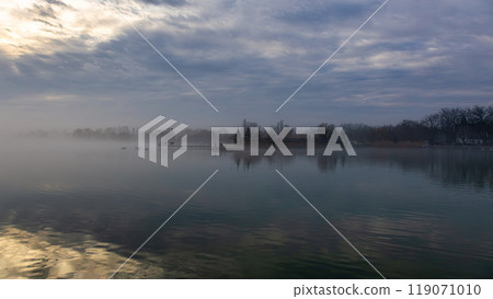 Blue sky with clouds and reflection for background. Keszthely city, Lake Balaton of Hungary 119071010