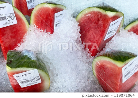 Fresh watermelon slices on ice in a supermarket Fresh watermelon slices on ice in a supermarket 119071064