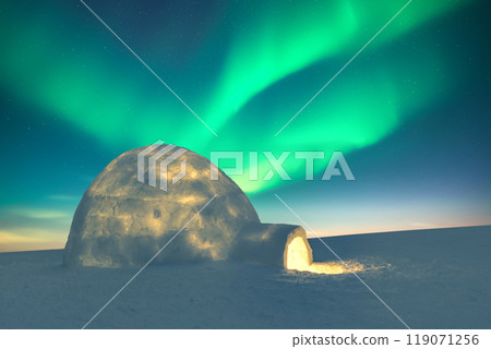 Wintry scene with glowing polar lights and snowy igloo 119071256