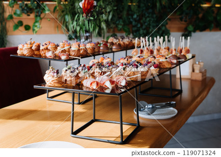 Assorted gourmet appetizers and desserts on display, luxury events, catering, and celebrations Assorted gourmet appetizers and desserts on display, luxury events, catering, and celebrations 119071324
