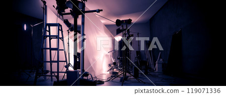 Photo or Video production studio with professional equipment preparation before shooting. Studio LED continuous lights arranging behind diffuser plates for softer light to the product and background. 119071336