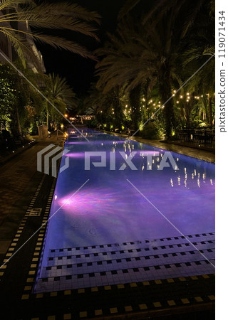 Swimming pool in the hotel with beautiful lighting at night Swimming pool in the hotel with beautiful lighting at night 119071434