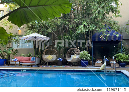 Garden furniture near the pool, patio interior Garden furniture near the pool, patio interior 119071445