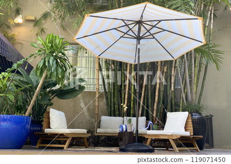 Garden furniture near the pool, patio interior 119071450