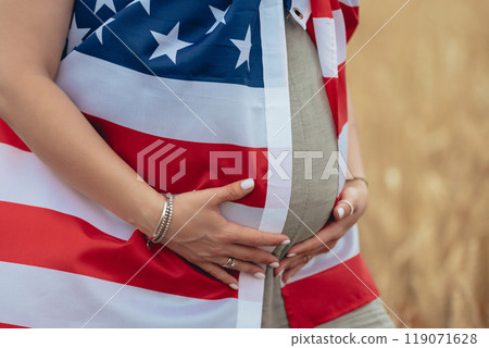 Pregnant Patriot Woman Belly with American National Flag In Wheat Field. USA 119071628