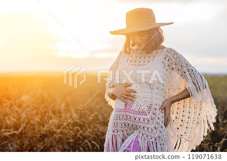 Beautiful Hippie Pregnant Woman With Baby Bump Belly On Nature Background. Pink Beautiful Hippie Pregnant Woman With Baby Bump Belly On Nature Background. Pink 119071638
