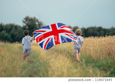 Little Boys British Patriot Kids Running With National Flag On Countryside Road. 119071645