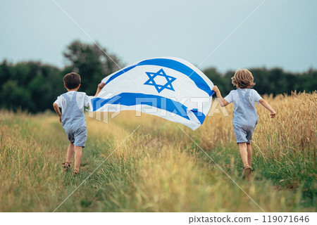Happy Israeli Jewish Little Boys Runs With Israel National Flag. Independence Happy Israeli Jewish Little Boys Runs With Israel National Flag. Independence 119071646