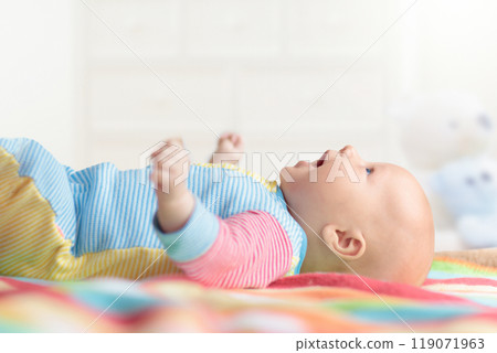 Little baby on white bed Little baby on white bed 119071963
