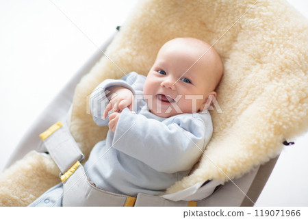 Adorable baby on sheepskin blanket Adorable baby on sheepskin blanket 119071966