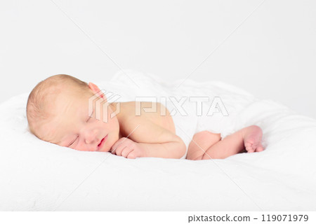Newborn baby boy in hospital cot Newborn baby boy in hospital cot 119071979