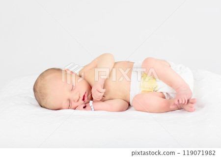 Newborn baby boy in hospital cot Newborn baby boy in hospital cot 119071982