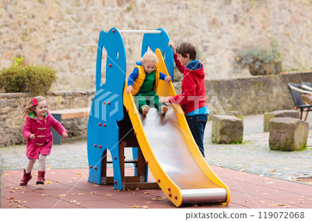 Kids playing in autumn park Kids playing in autumn park 119072068