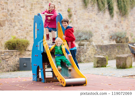 Kids playing in autumn park Kids playing in autumn park 119072069