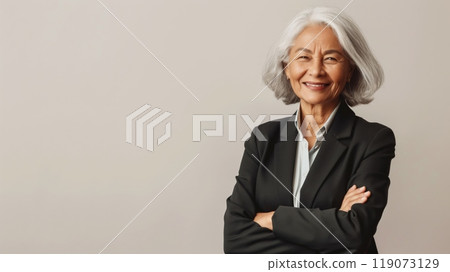 Professional Elderly Woman with Gray Hair in Business Attire, Confidently Smiling, Studio Shot 119073129