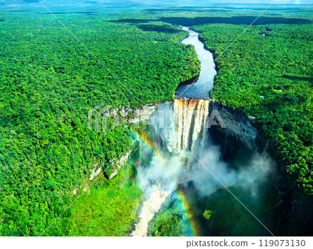 Aerial view of Kaieteur Falls with a rainbow in the Amazon rainforest, Guyana. One of the highest and most powerful waterfalls in the world, surrounded by lush tropical landscape 119073130