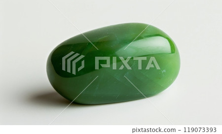 CloseUp Photograph of a Single Polished Jade Gemstone on a White Background for Jewelry and Gemology Purposes 119073393