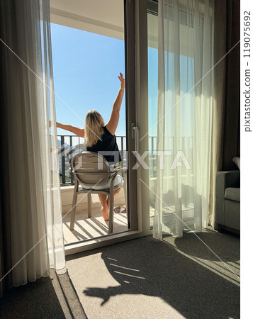 A woman  on the balcony 119075692