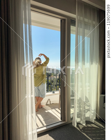 A woman  on the balcony 119075699