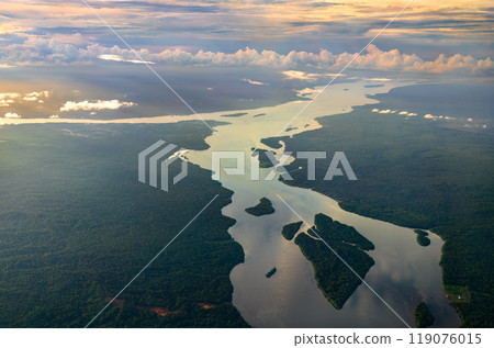 The Essequibo and Cuyuni rivers in the Amazon rainforest of Guyana at sunset. South America The Essequibo and Cuyuni rivers in the Amazon rainforest of Guyana at sunset. South America 119076015