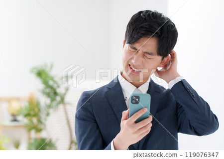 Man in suit, smartphone Man in suit, smartphone 119076347