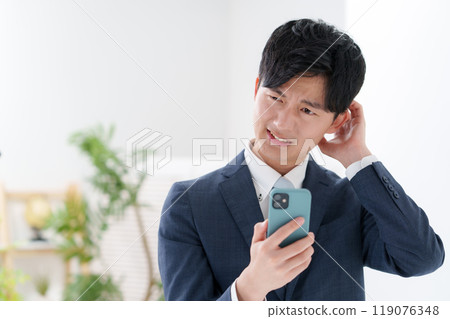 Man in suit, smartphone Man in suit, smartphone 119076348