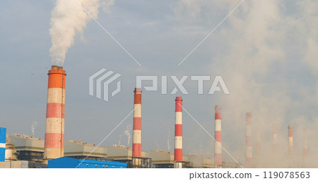 Power stations manufacturing electrical industrial plant. Electric power building refinery engineering smog steam smokestack. Lignite electricity chimneys release pollution in industry plant blue sky 119078563