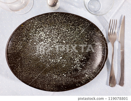 Various cutlery on the table - preparation with festive banquet 119078801
